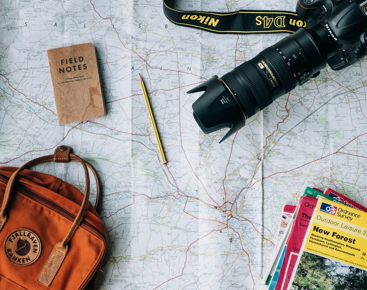 A map, a notebook and a camera — planning a trip with TURISTO