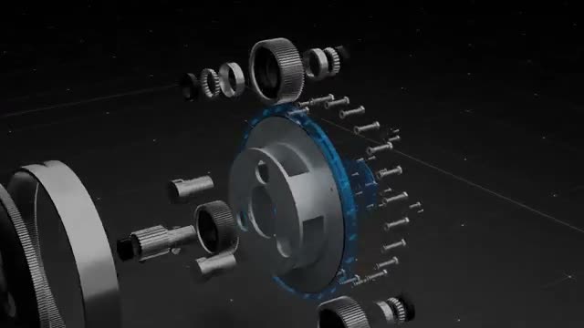 A gearbox shown in 3D with its parts pulled apart: gears, bearings, bolts and the housing ring separated along their axis.